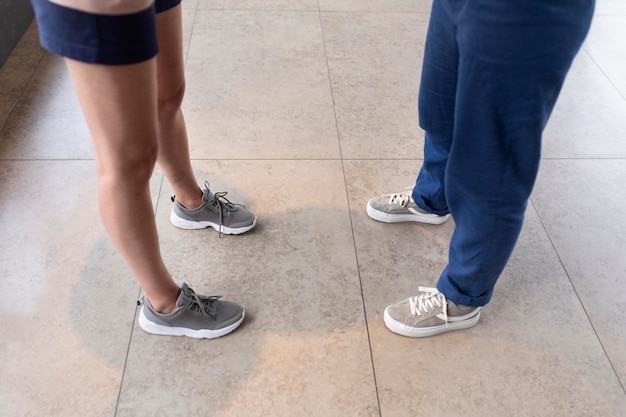 Two pairs of walking shoes set side by side for comparison